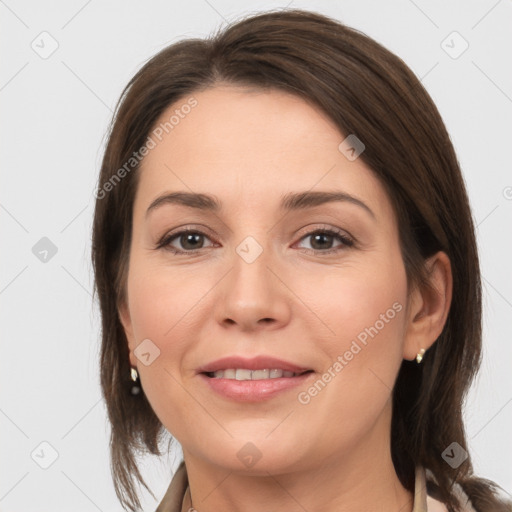 Joyful white young-adult female with medium  brown hair and grey eyes