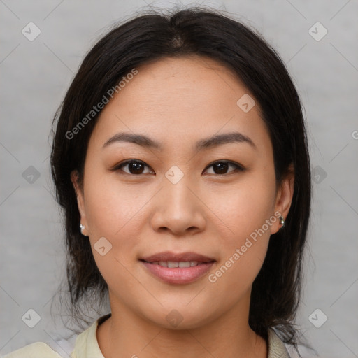 Joyful asian young-adult female with medium  brown hair and brown eyes