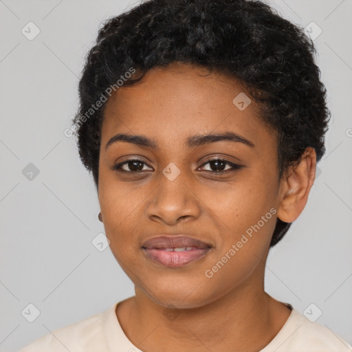 Joyful black young-adult female with short  black hair and brown eyes