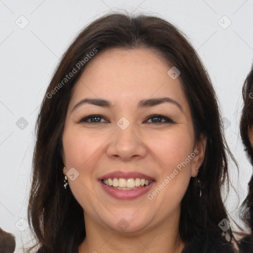 Joyful white adult female with long  brown hair and brown eyes