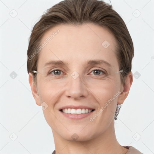 Joyful white young-adult female with short  brown hair and grey eyes