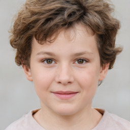 Joyful white child male with short  brown hair and brown eyes