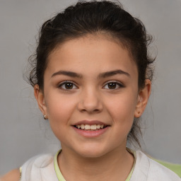 Joyful white child female with medium  brown hair and brown eyes