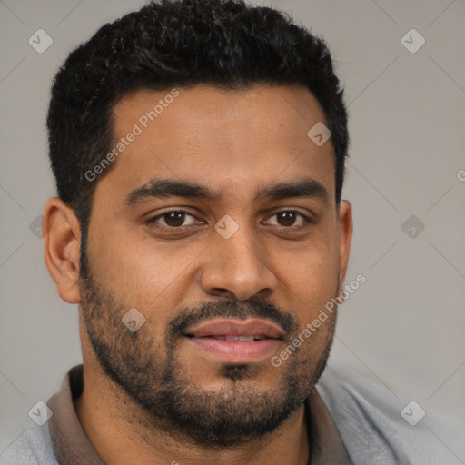 Joyful latino young-adult male with short  black hair and brown eyes