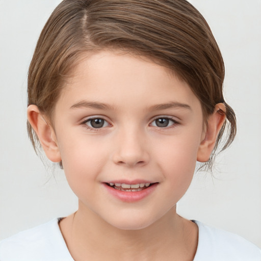 Joyful white child female with medium  brown hair and brown eyes