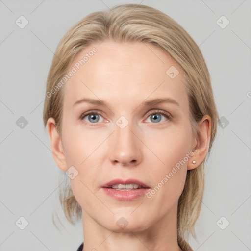 Joyful white adult female with medium  brown hair and blue eyes