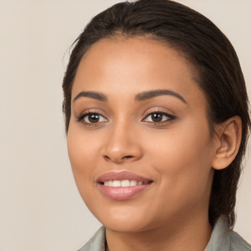 Joyful white young-adult female with medium  brown hair and brown eyes