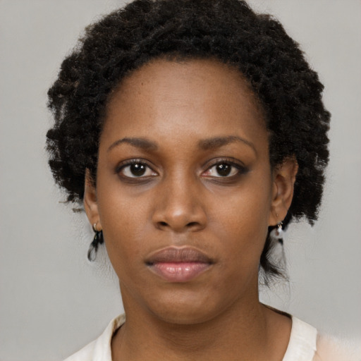 Neutral black young-adult female with medium  black hair and brown eyes