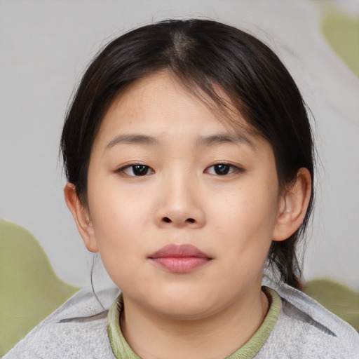 Neutral asian child female with medium  brown hair and brown eyes