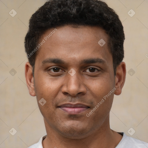 Joyful latino young-adult male with short  brown hair and brown eyes