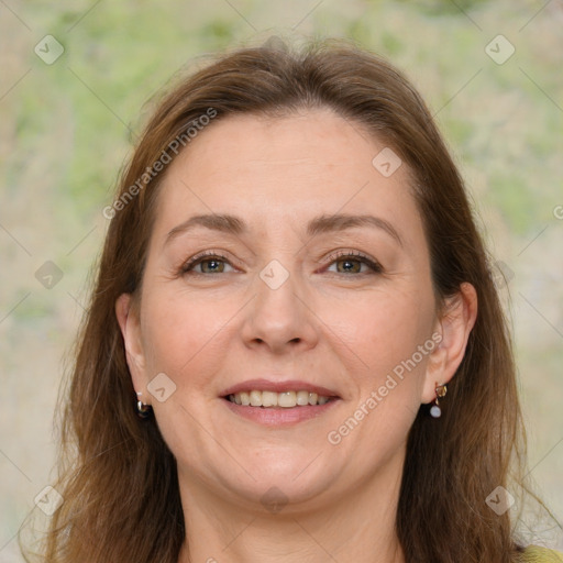 Joyful white adult female with medium  brown hair and green eyes