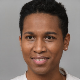 Joyful black young-adult male with short  brown hair and brown eyes