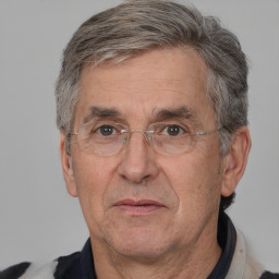 Neutral white middle-aged male with short  gray hair and brown eyes