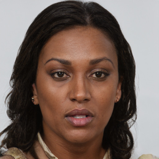 Neutral black young-adult female with long  brown hair and brown eyes