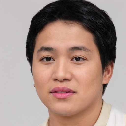 Joyful asian young-adult male with short  black hair and brown eyes