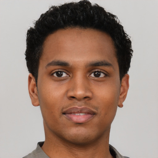 Neutral black young-adult male with short  black hair and brown eyes