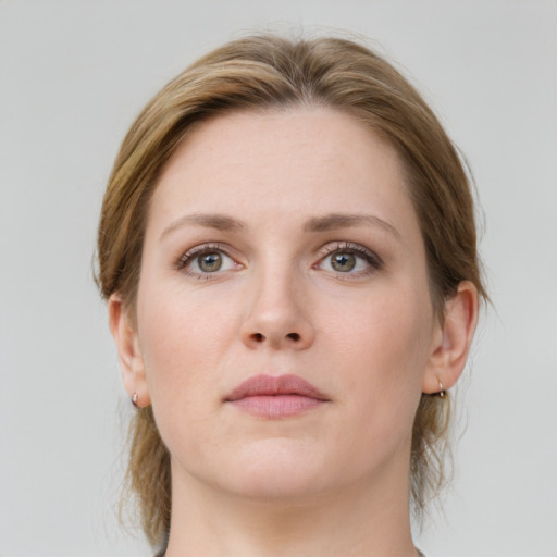 Neutral white young-adult female with medium  brown hair and green eyes