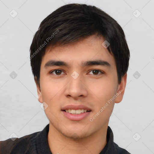 Joyful white young-adult male with short  black hair and brown eyes