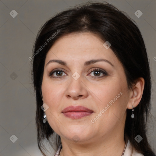 Joyful white adult female with medium  brown hair and brown eyes