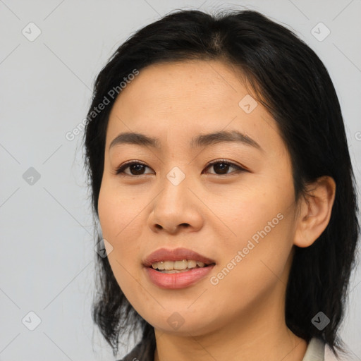 Joyful asian young-adult female with medium  brown hair and brown eyes