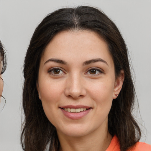 Joyful white young-adult female with medium  brown hair and brown eyes