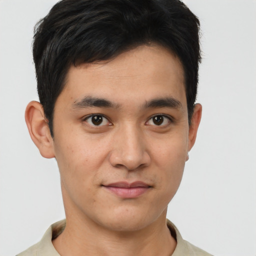 Joyful asian young-adult male with short  brown hair and brown eyes