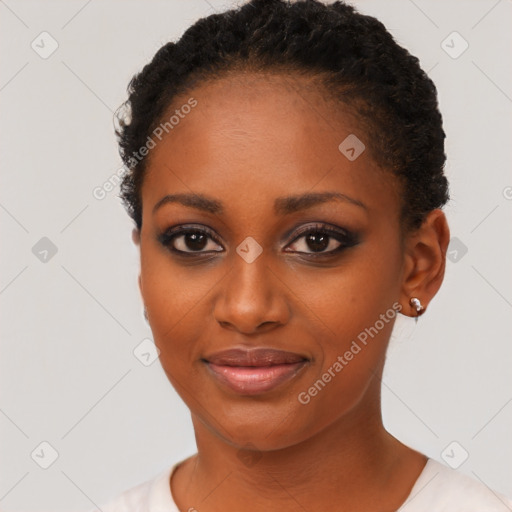 Joyful black young-adult female with short  black hair and brown eyes