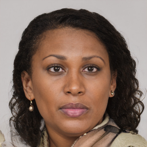 Neutral black adult female with medium  brown hair and brown eyes