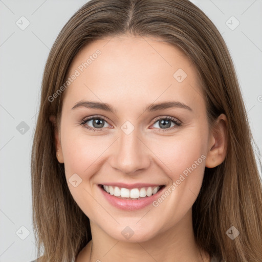 Joyful white young-adult female with long  brown hair and grey eyes