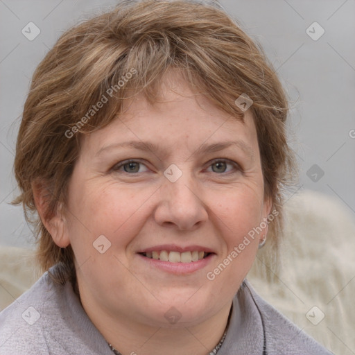 Joyful white adult female with medium  brown hair and blue eyes