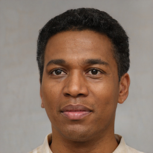 Neutral black young-adult male with short  black hair and brown eyes
