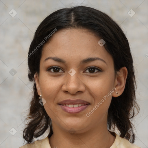 Joyful latino young-adult female with medium  brown hair and brown eyes