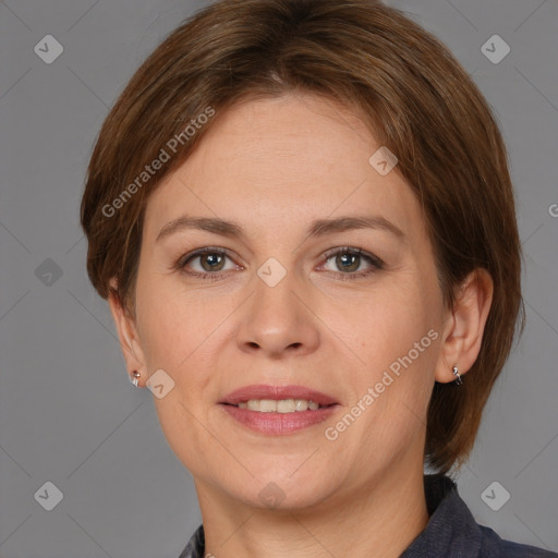 Joyful white adult female with medium  brown hair and grey eyes