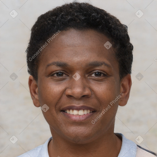 Joyful black young-adult female with short  brown hair and brown eyes