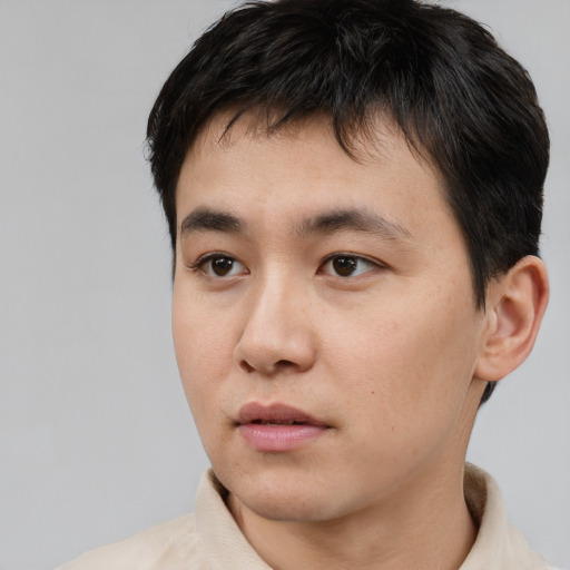 Neutral asian young-adult male with short  black hair and brown eyes