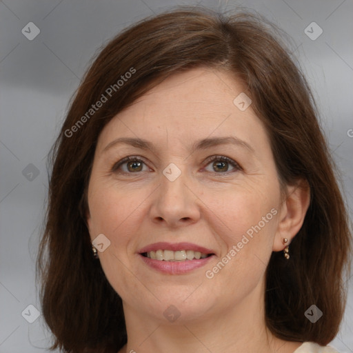 Joyful white adult female with medium  brown hair and brown eyes