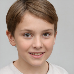 Joyful white child female with short  brown hair and brown eyes