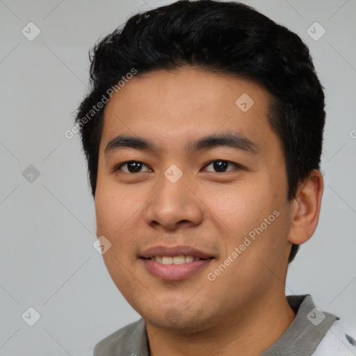 Joyful asian young-adult male with short  black hair and brown eyes