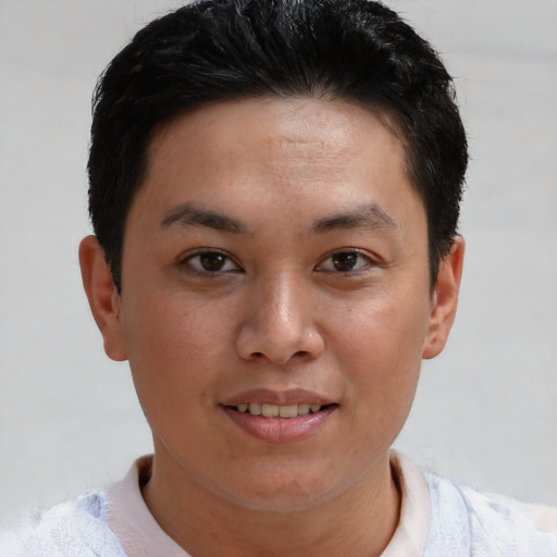 Joyful asian young-adult female with short  brown hair and brown eyes