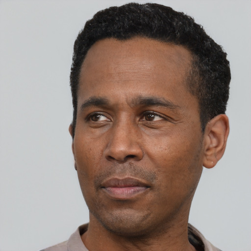 Neutral black adult male with short  black hair and brown eyes