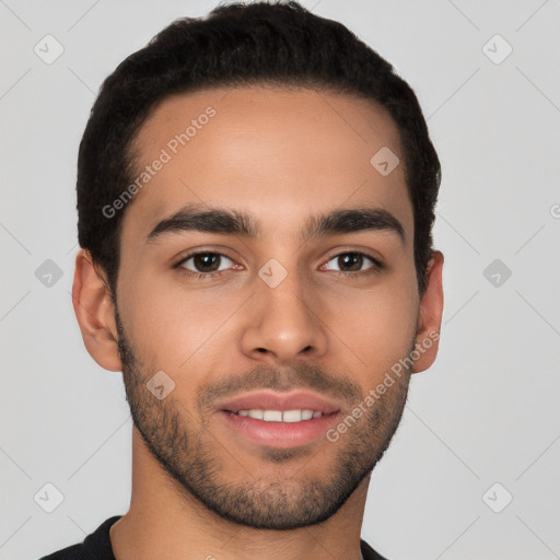 Joyful latino young-adult male with short  brown hair and brown eyes