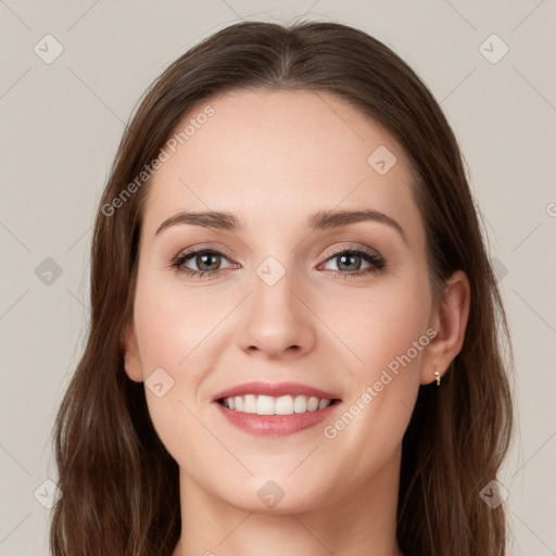 Joyful white young-adult female with long  brown hair and green eyes