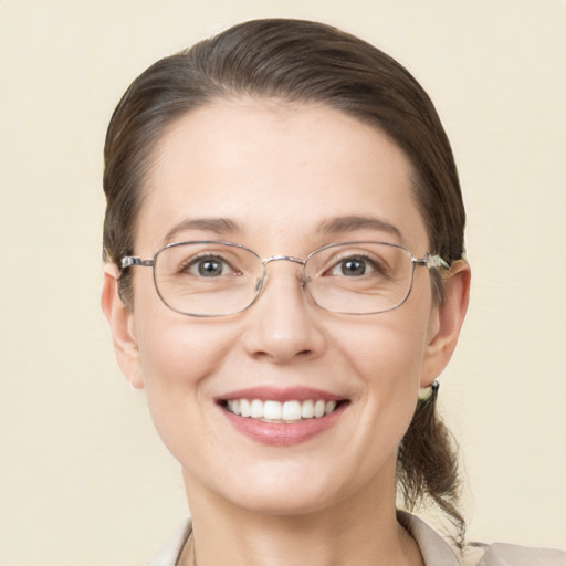 Joyful white adult female with short  brown hair and brown eyes