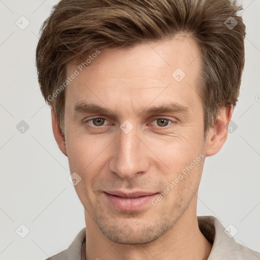 Joyful white adult male with short  brown hair and grey eyes