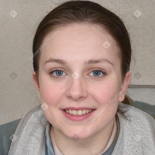 Joyful white young-adult female with short  brown hair and blue eyes