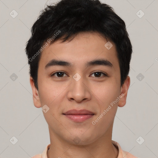 Joyful asian young-adult male with short  brown hair and brown eyes