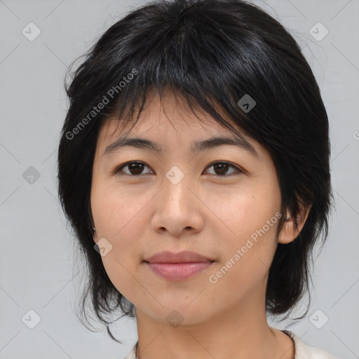 Joyful asian young-adult female with medium  brown hair and brown eyes