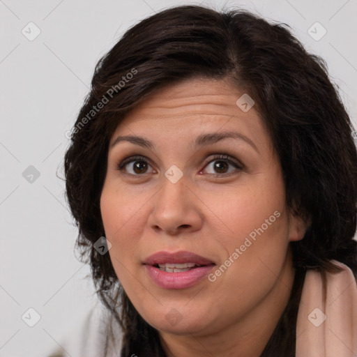 Joyful white adult female with long  brown hair and brown eyes