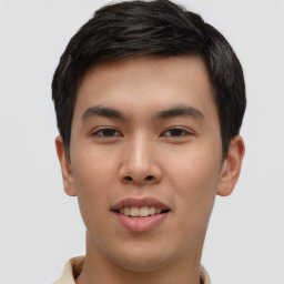 Joyful asian young-adult male with short  brown hair and brown eyes