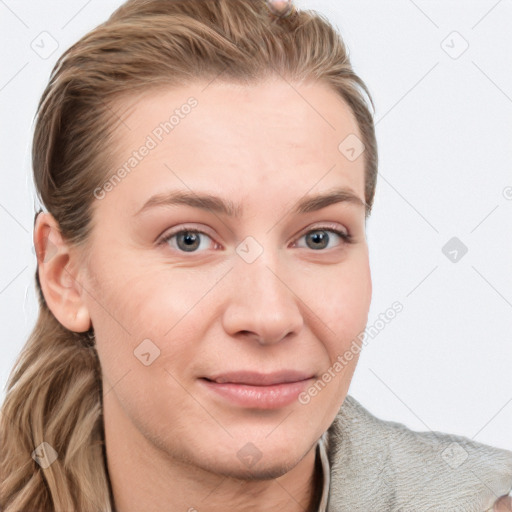 Joyful white young-adult female with long  brown hair and blue eyes